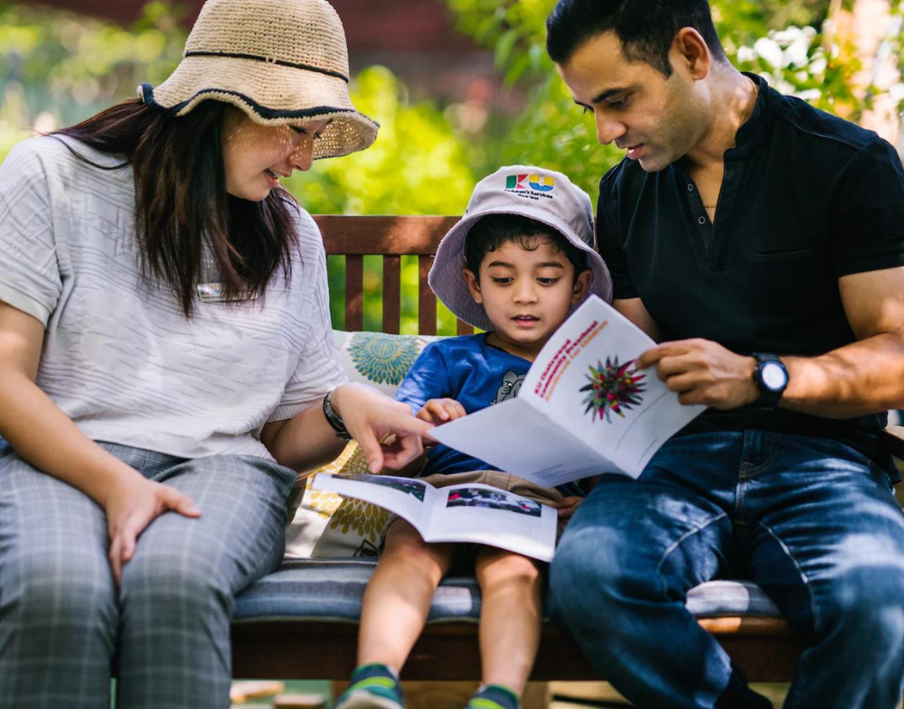 parents and child browsing brochure