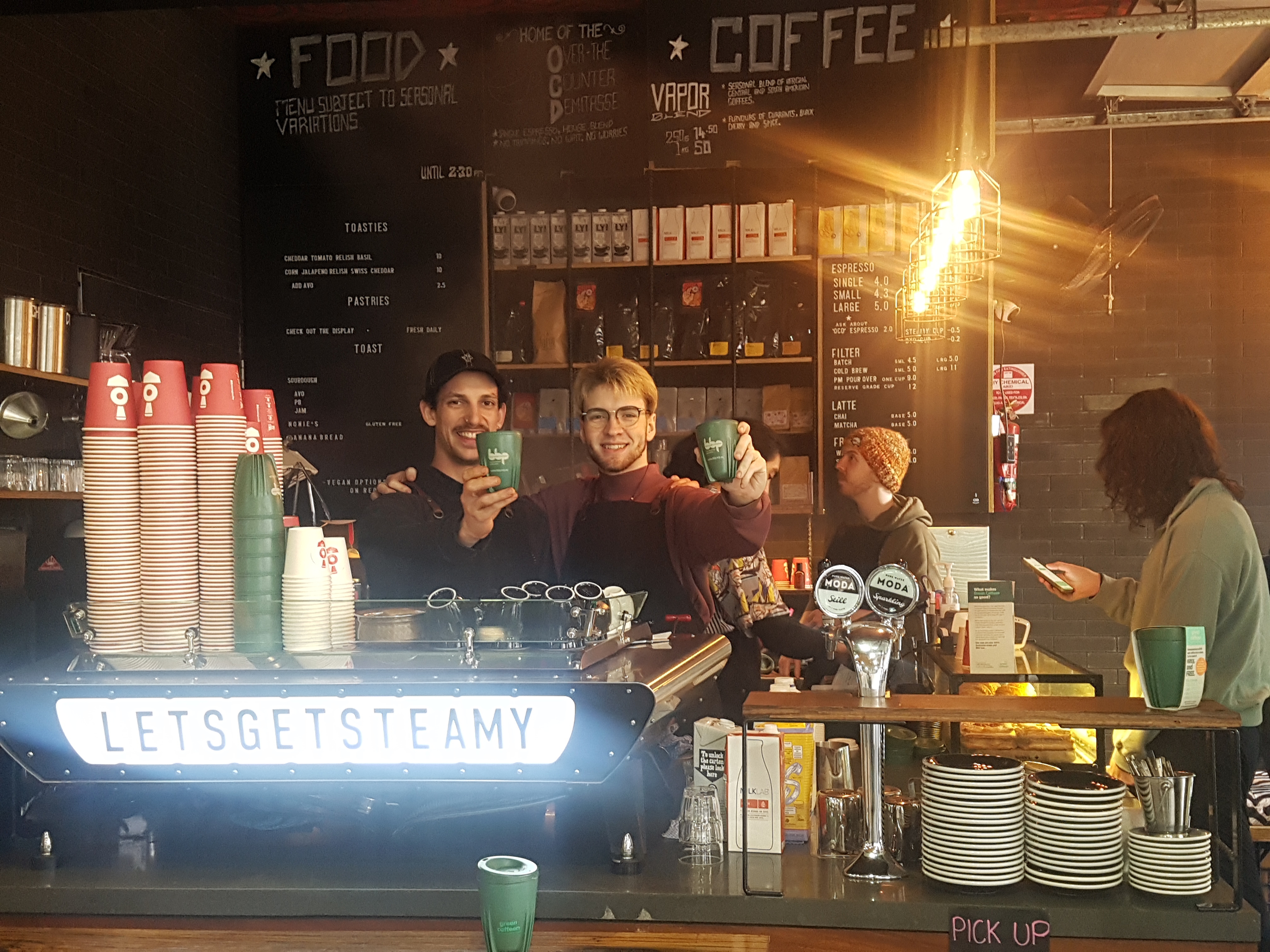 Steam Engine Cafe team with Green Caffeen cups