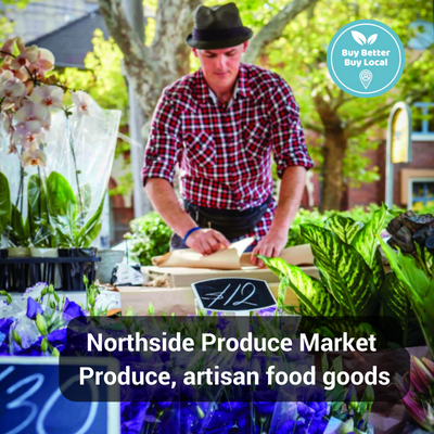 Northside produce market stall with man selling flowers